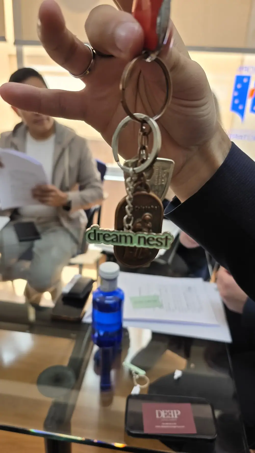 A Dream Nest branded keychain, given at signing